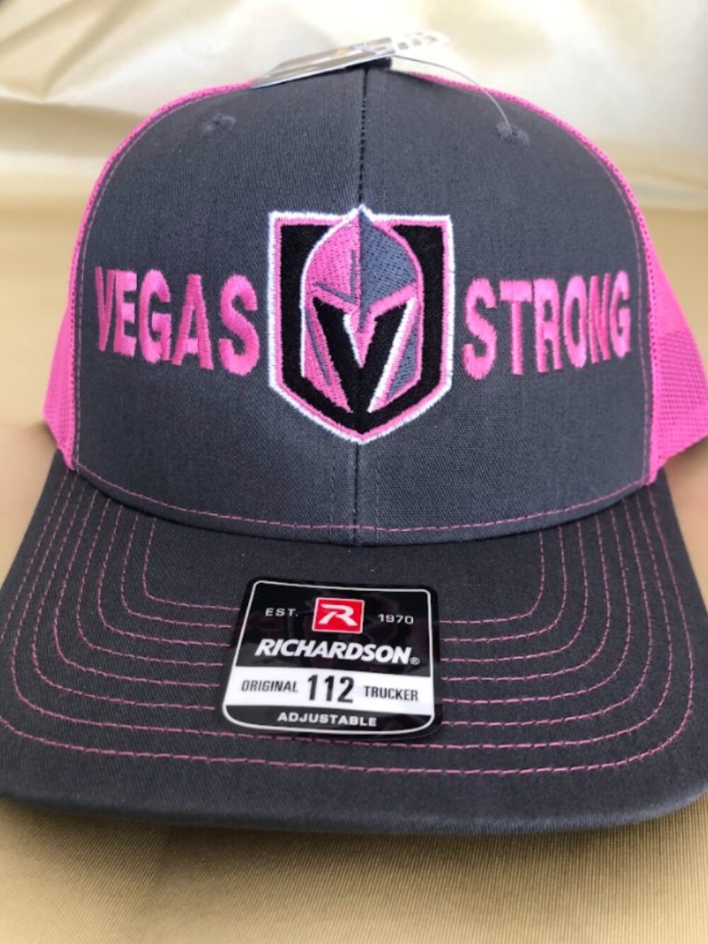 Las Vegas Golden Knights Vegas Strong Grey and Pink Mesh Trucker Snapback Hat!